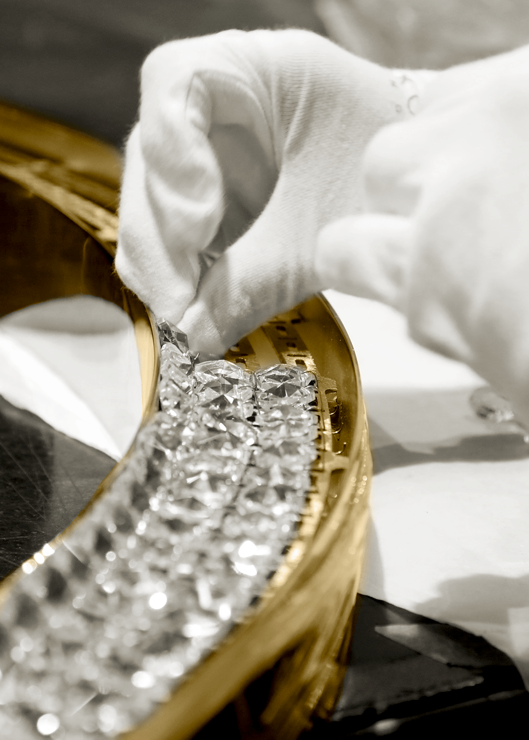 Placement of crystals in a luxury lamp by Castro Lighting, highlighting the precision and sophistication in the assembly process.