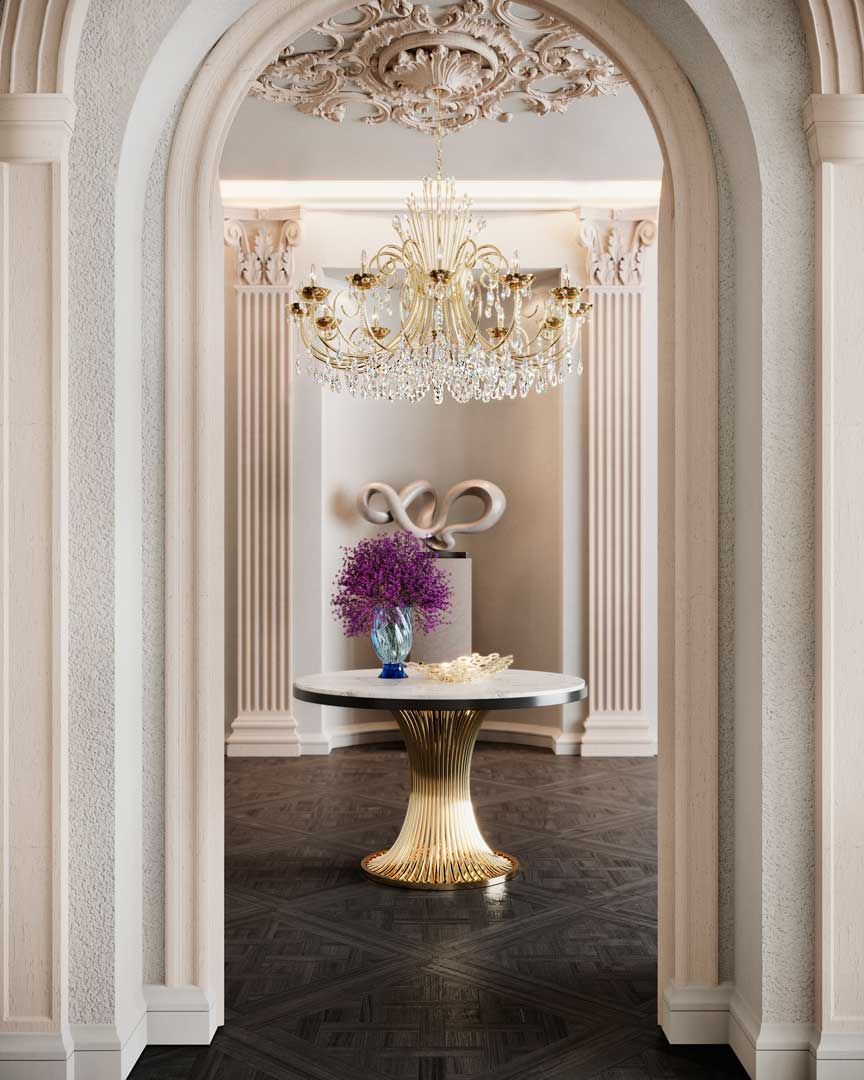/storage/Luxury brass dining table with flowing sculptural base and round Emperador marble top, inspired by the elegant movement of dancers and crafted for sophisticated interiors.