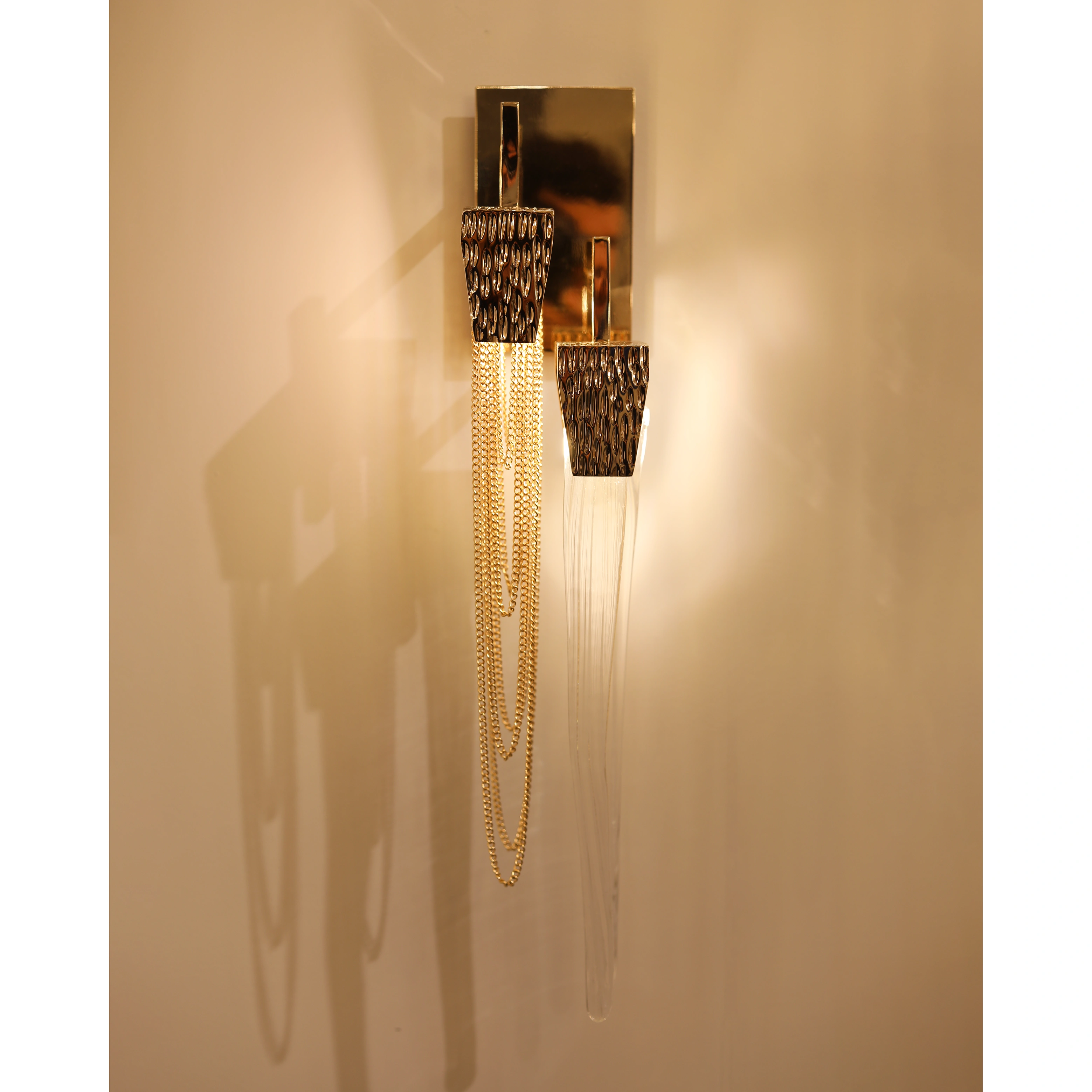 /storage/Luxury brass Stala Wall Light with crystal details, inspired by stalactites, handcrafted for modern elegant interiors.