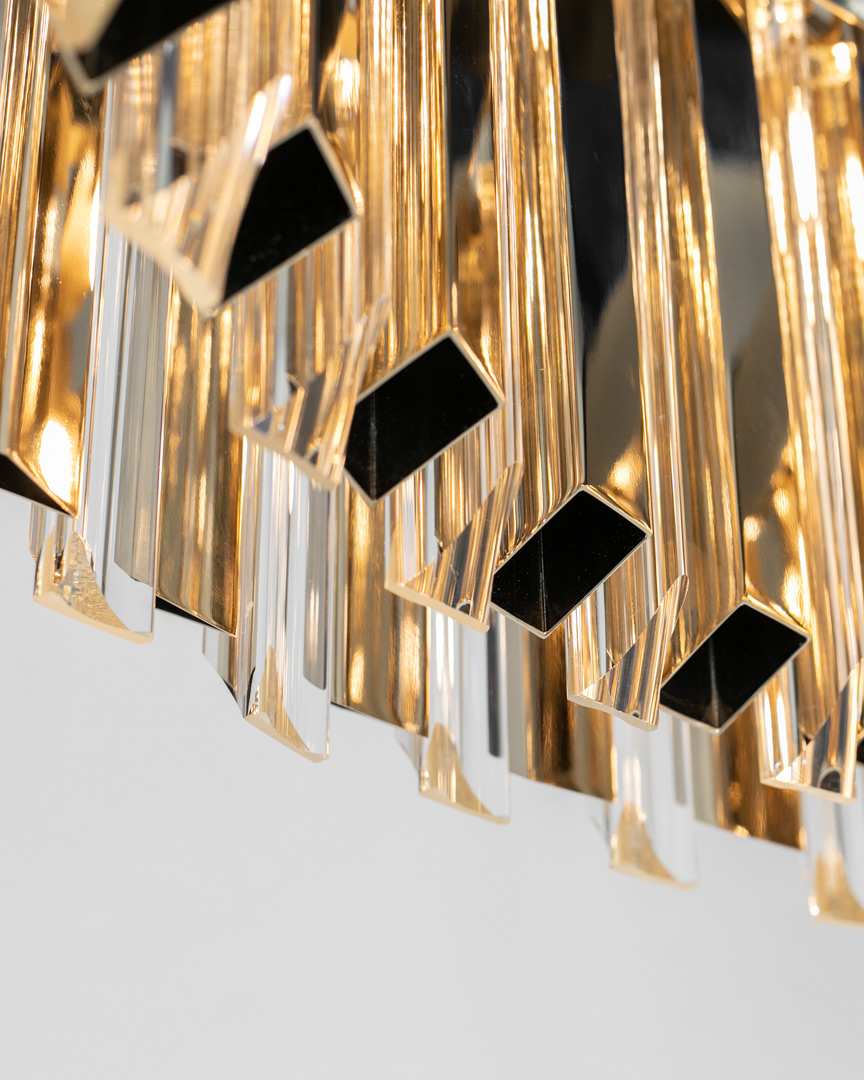 /storage/Luxury brass Skylar Suspension chandelier with glass elements, a bold handcrafted design inspired by celestial geometry.