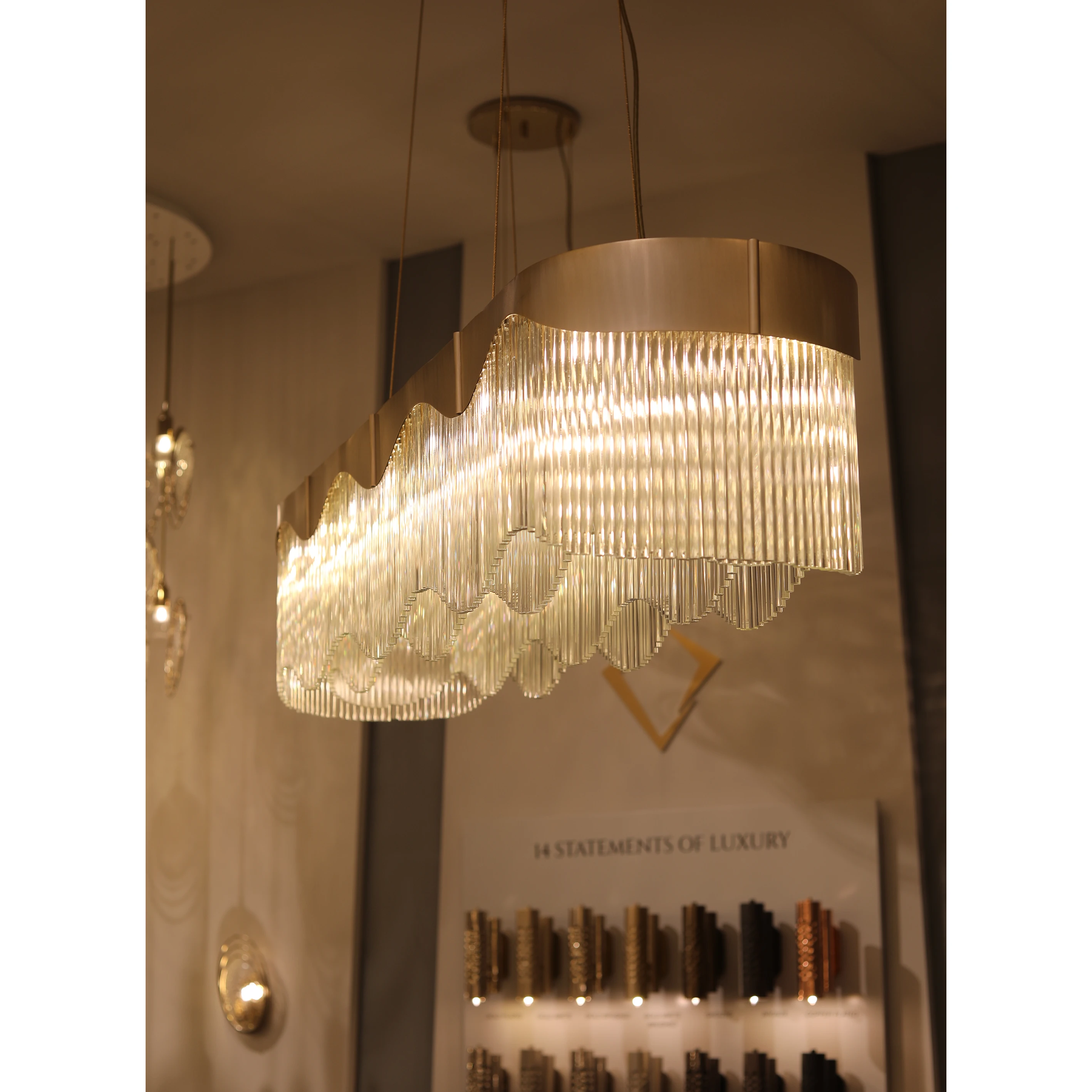 /storage/Luxury brass snooker chandelier with fluid curves and wave-inspired design, fully customizable in size and configuration for elegant modern interiors.