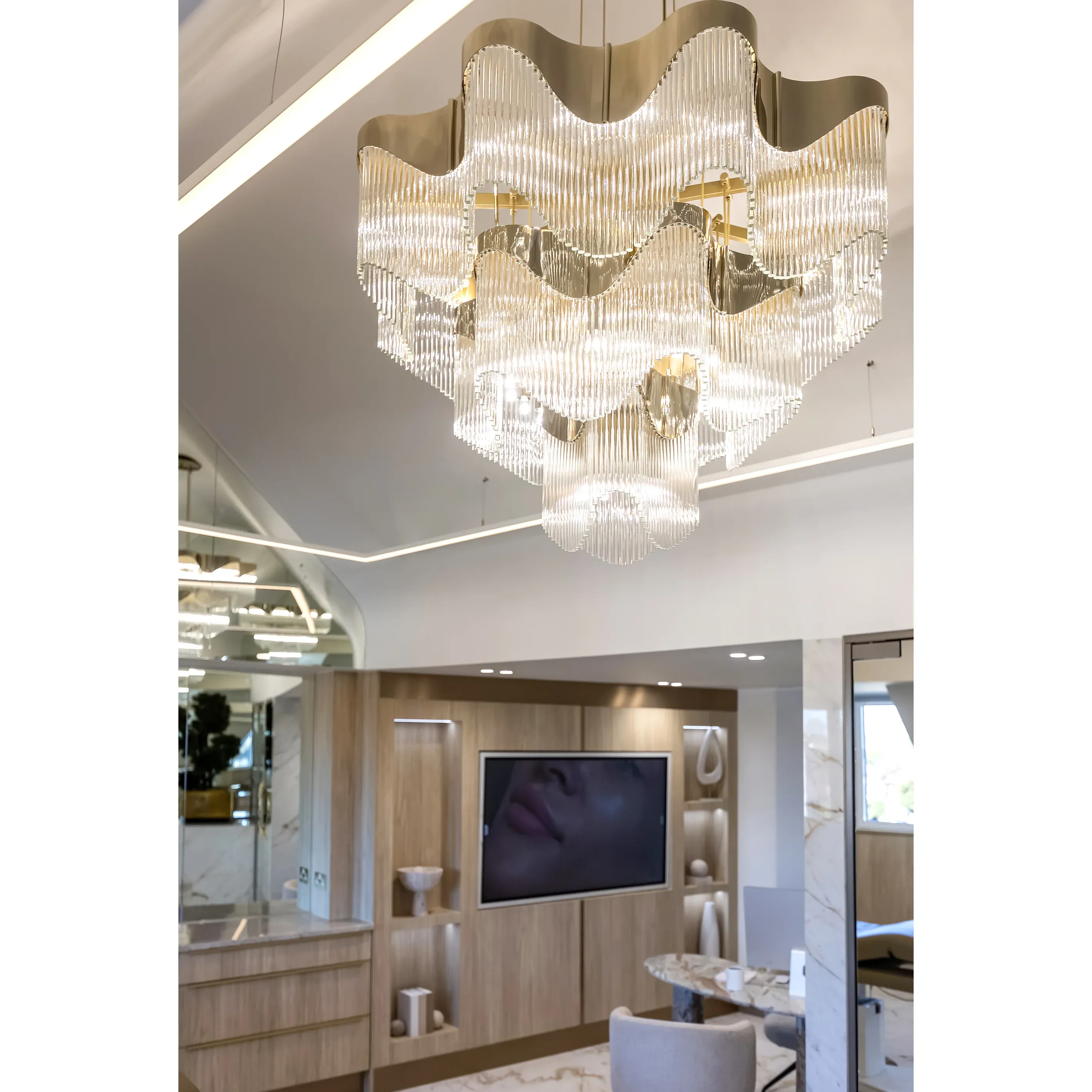 /storage/Luxury brass chandelier with sculptural curves and abstract design by Castro Lighting