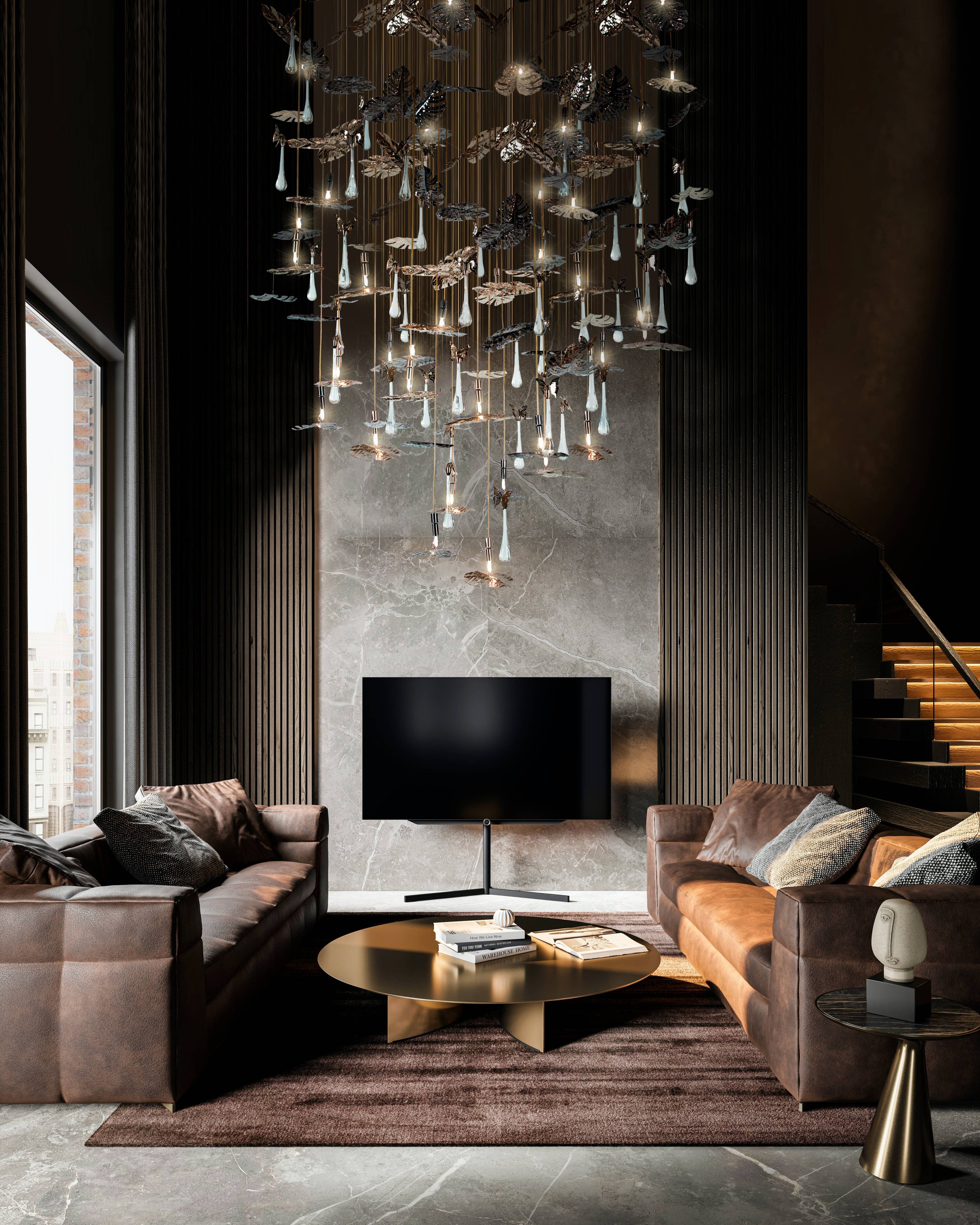 Rainforest Suspension chandelier featuring gold-plated brass and clear crystal glass, elegantly illuminating a modern living room with nature-inspired design.