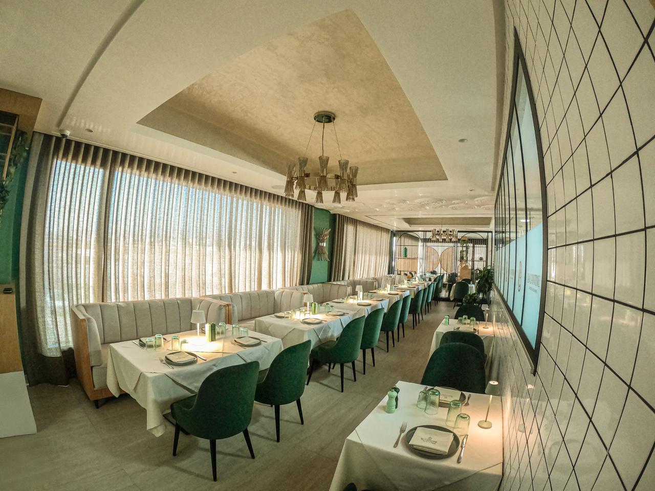Interior of La Cantine d’Agadir restaurant in Morocco featuring contemporary design with Halo Collection lighting and furnishings by Castro Lighting.