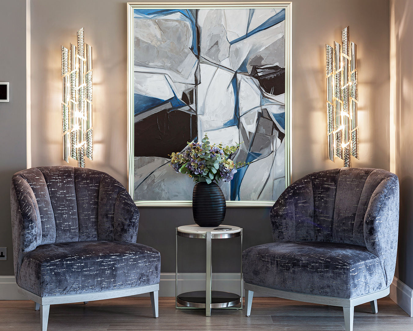 Triumph Wall Light by Castro Lighting shown in a contemporary hallway – sculptural dual brass tubes creating a refined and timeless wall feature.