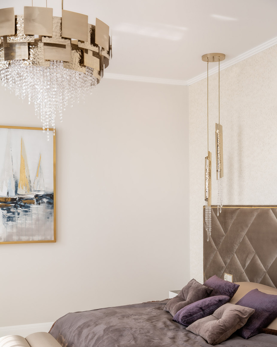 Elegant Avolto pendant light with hammered 24k gold-plated brass tubes and hand-assembled crystal accents