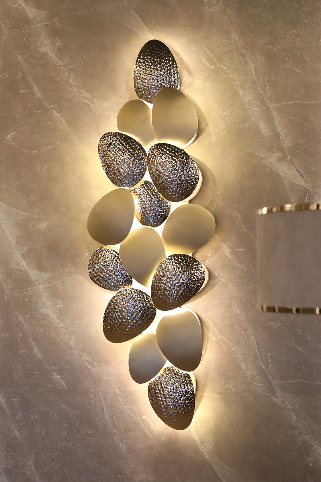 Mastery Wall Light luxury wall sconce by Castro Lighting in Porto showroom, showcasing Portuguese craftsmanship in brass.