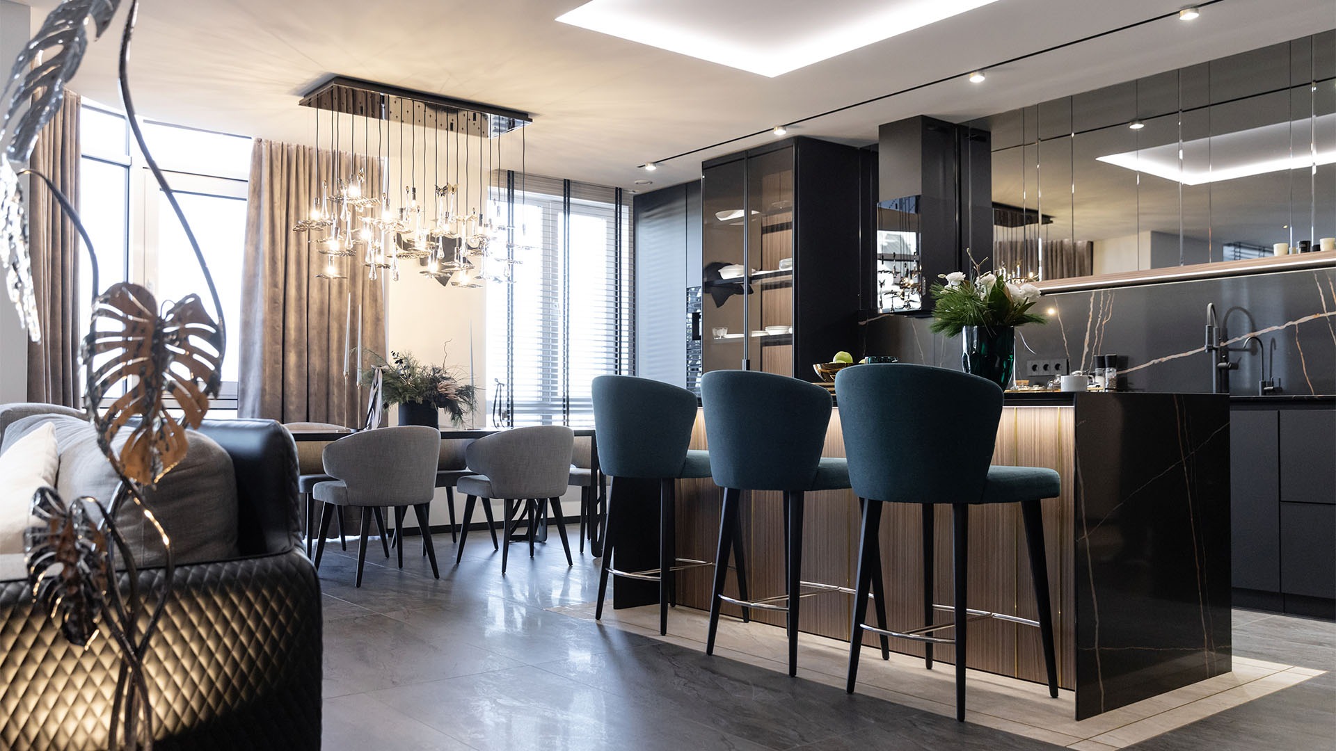 Timeless Geometry interior featuring strong architectural lines, dark finishes, natural textures and sculptural lighting, creating a refined balance between structure and warmth.