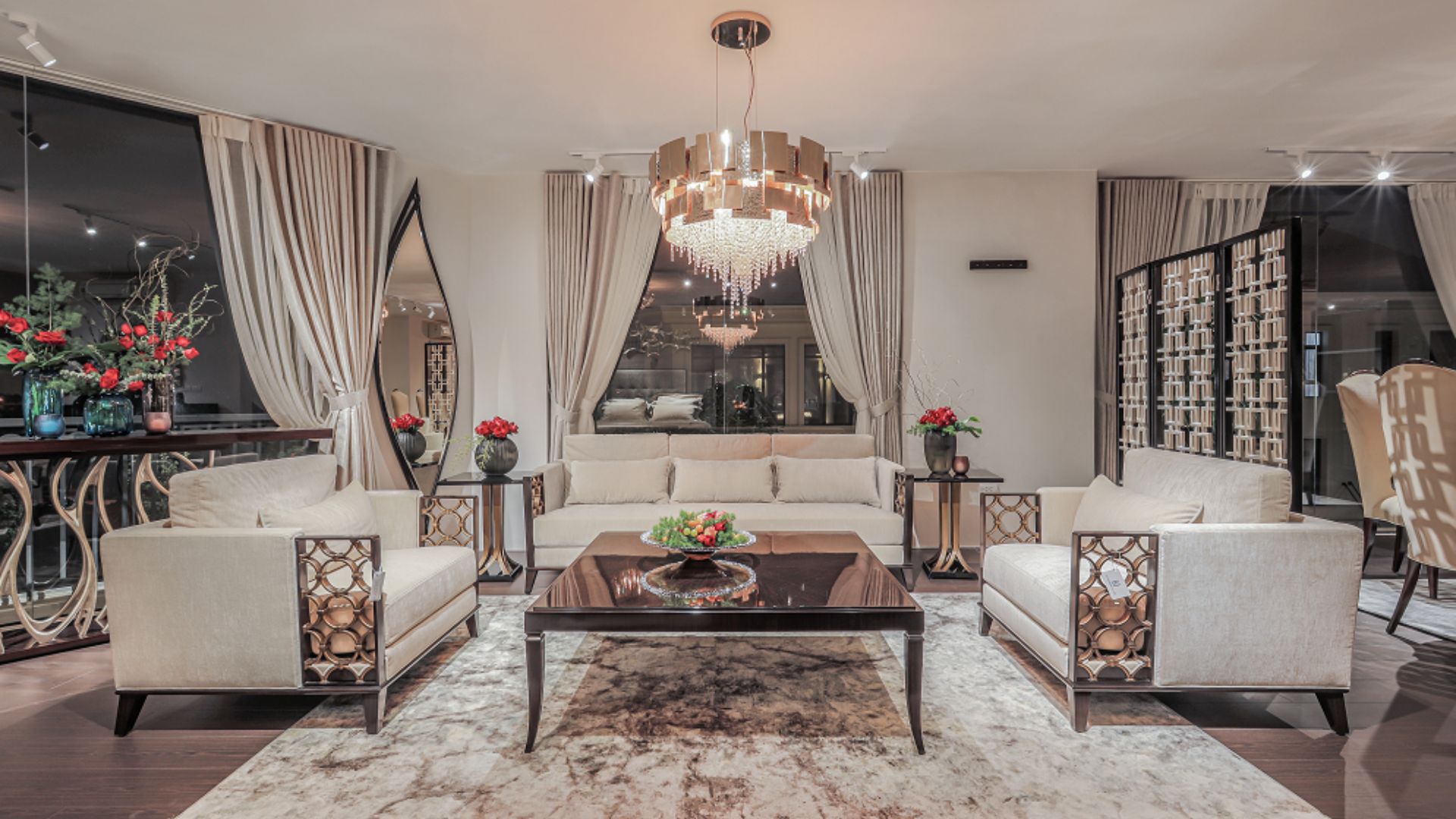 Luxury bedroom with Mondrian round suspension chandelier creating a modern and elegant ambiance