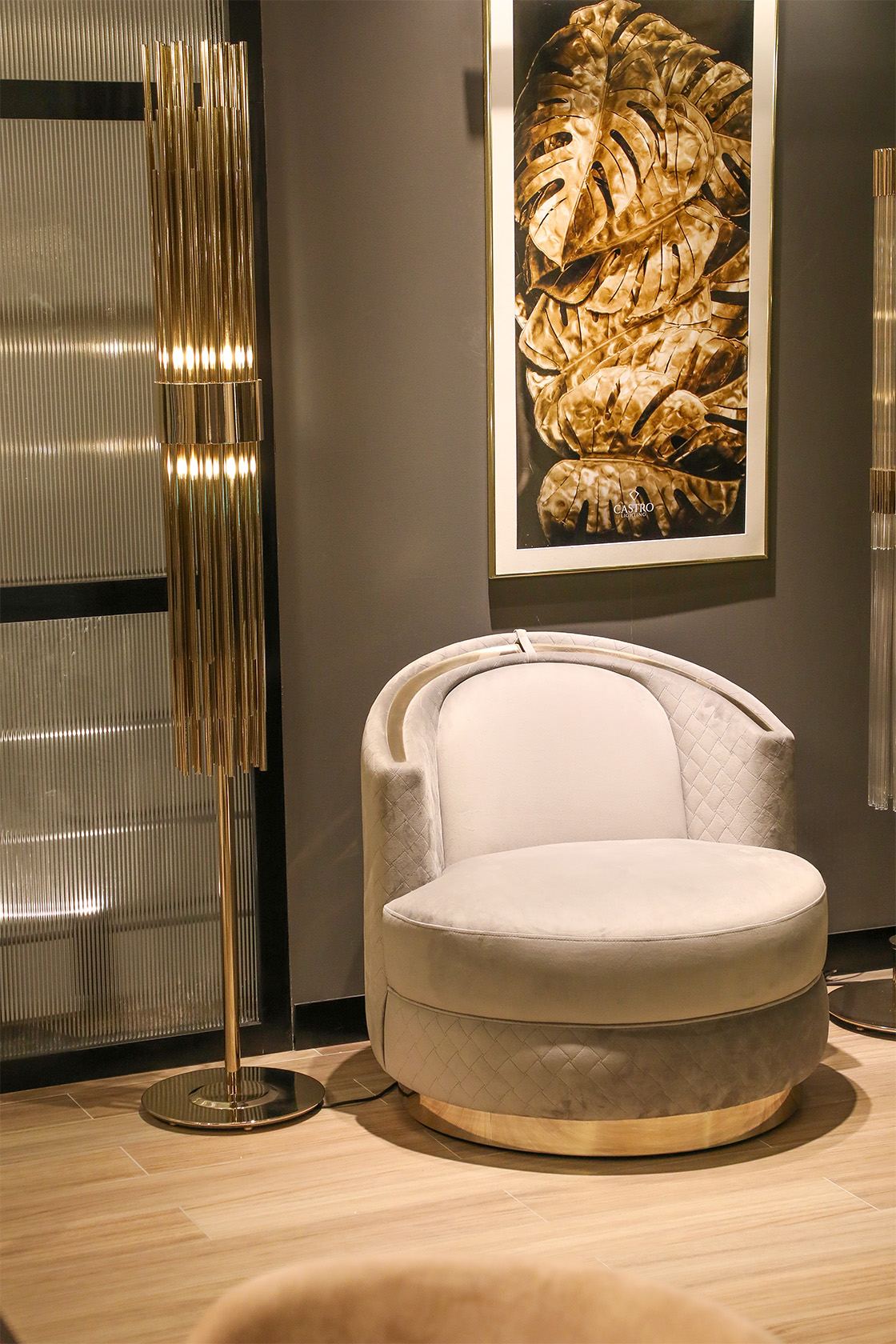 Castro Lighting showroom Porto with Carlo Armchair and Streamline Floor Lamp styled in a modern luxury interior corner.