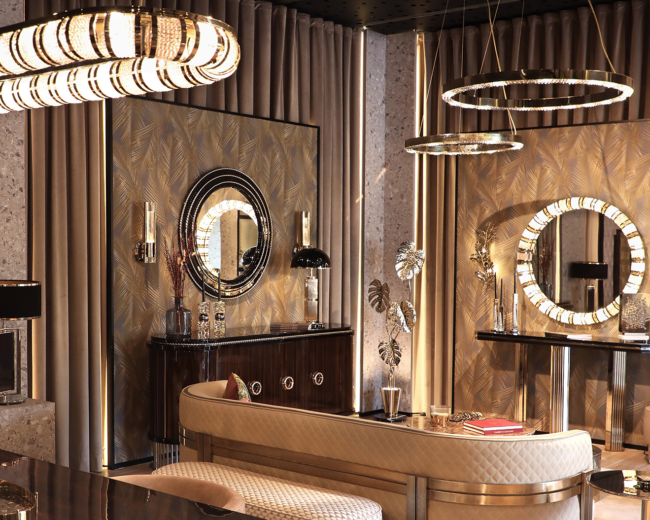 Wide view of the Castro Lighting showroom in Porto, Portugal, featuring chandeliers, pendants, and designer furniture styled in curated interior settings.