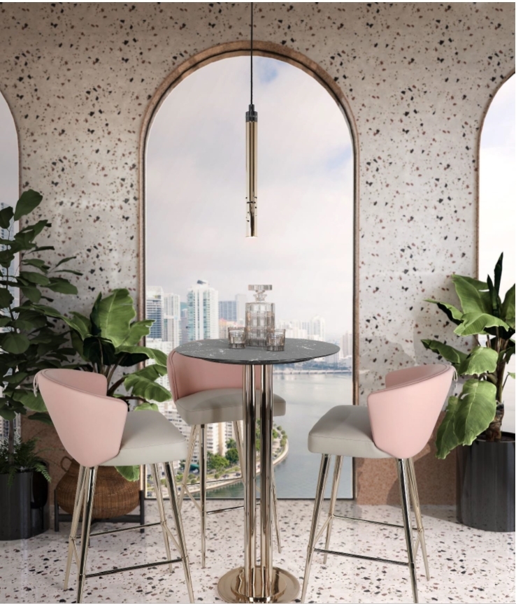 A refined bar featuring the Gio Pendant, Sedere Bai Chair and Charlotte Bar Table