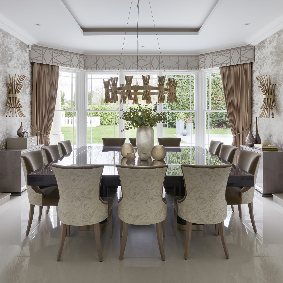  luxurious dining area, using a neutral palette with muted metallic tones and textures for a relaxed, calming feel, in Surrey, England. A project by Alexander James Interiors, featuring Halo Suspension and Flusso Wall Lights.