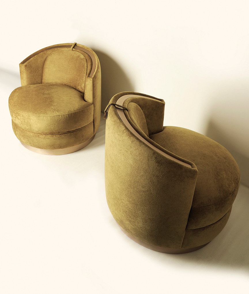 /storage/Luxury brass-accented modern lounge armchair with quilted padded fabric and smooth curves, combining comfort and elegance