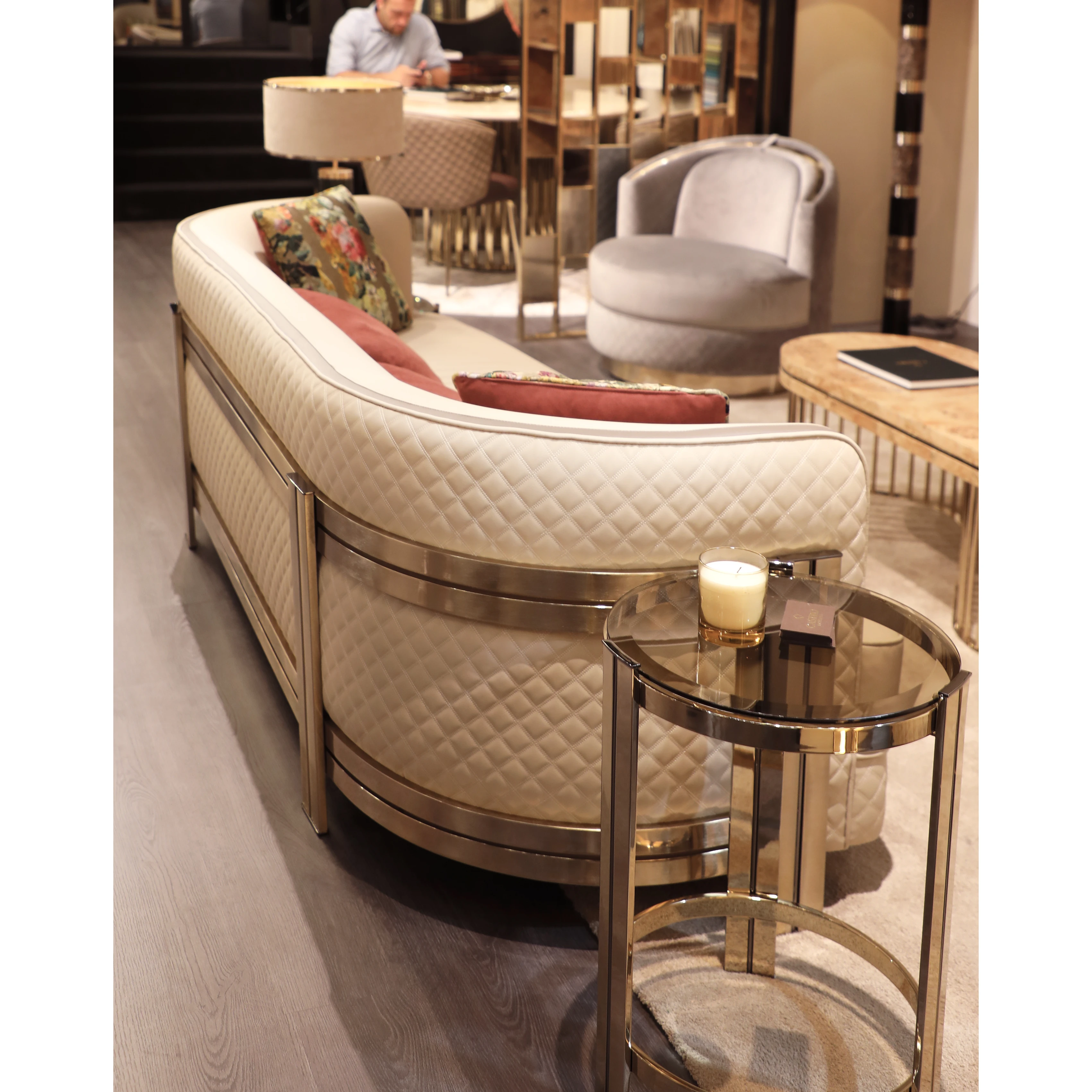 /storage/Luxury gold-plated brass sofa with soft upholstery, combining Versailles-inspired elegance and contemporary design by Castro Interiors