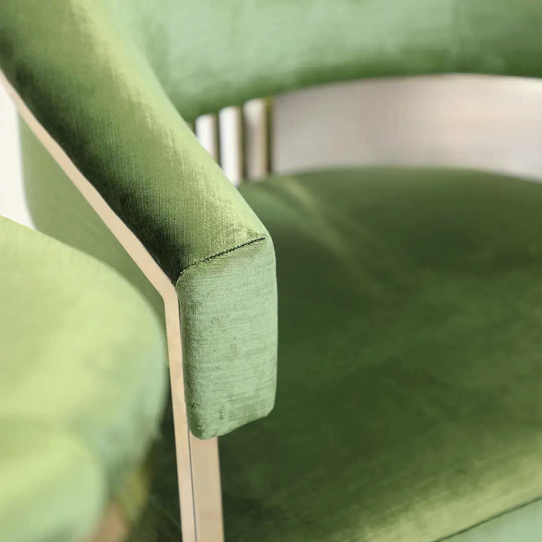 /storage/Luxury brass bar chair with elegant harp-shaped design by Castro Interiors.