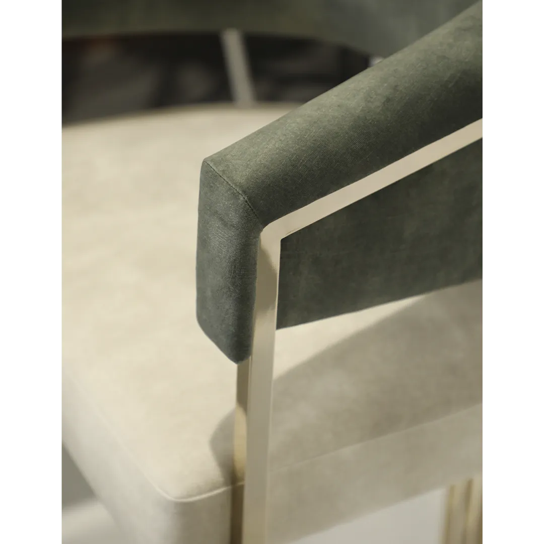 /storage/Luxury brass bar chair with elegant harp-shaped design by Castro Interiors.