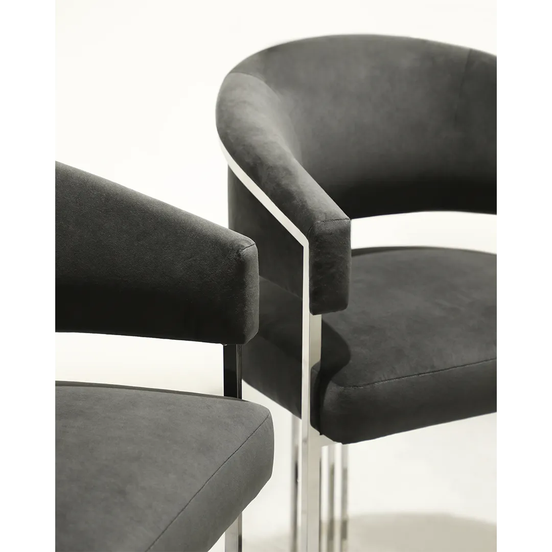 /storage/Luxury brass bar chair with elegant harp-shaped design by Castro Interiors.