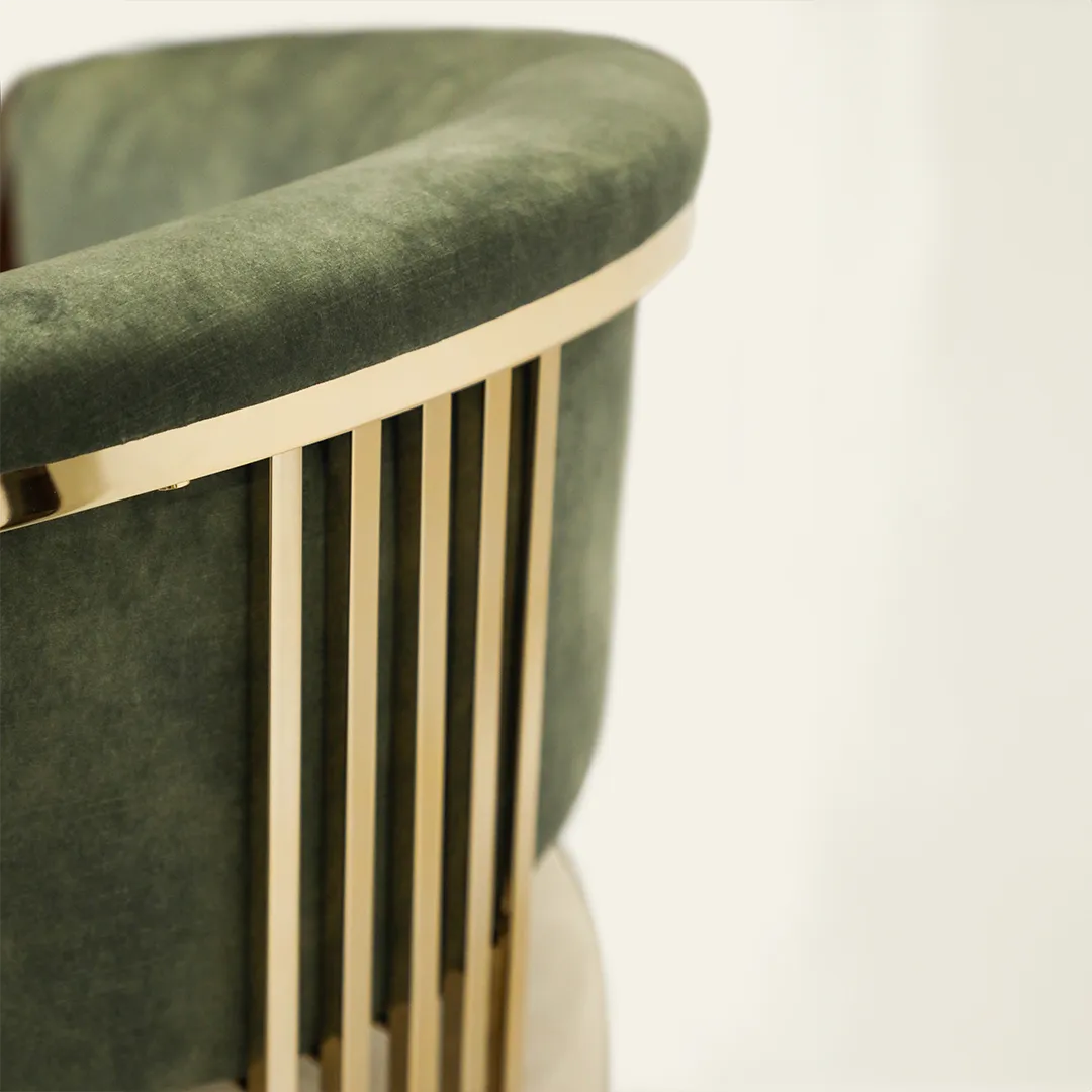 /storage/Luxury brass bar chair with elegant harp-shaped design by Castro Interiors.