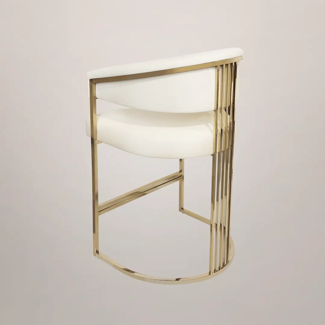 /storage/Luxury brass bar chair with elegant harp-shaped design by Castro Interiors.