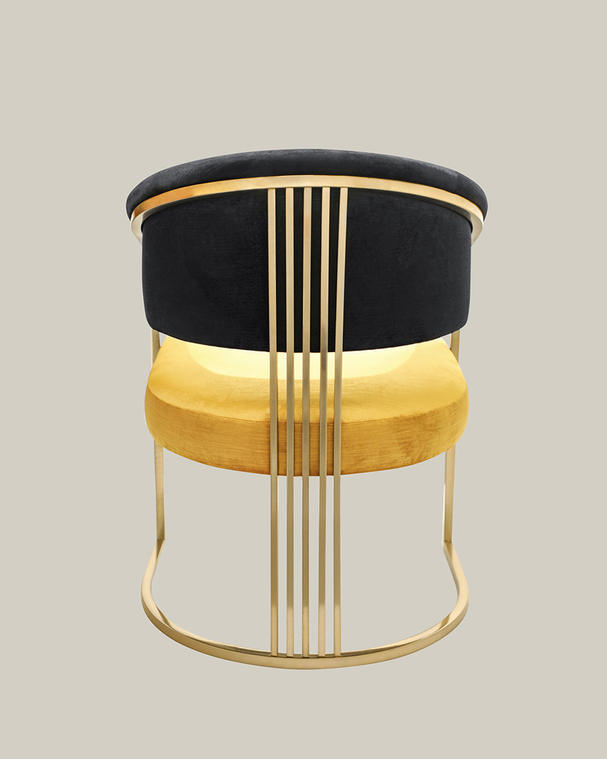 /storage/Luxury brass armchair with elegant harp-shaped design by Castro Interiors.