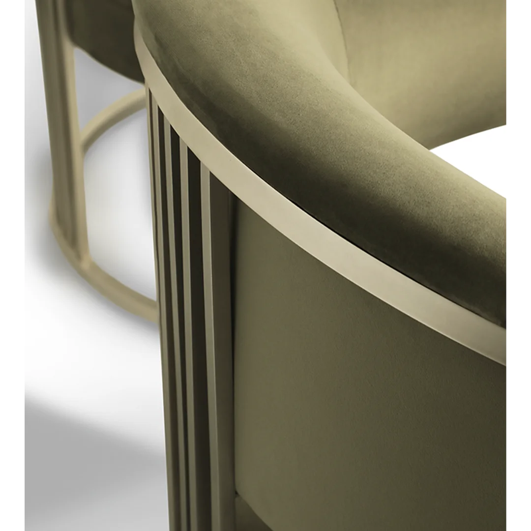 /storage/Luxury brass armchair with elegant harp-shaped design by Castro Interiors.