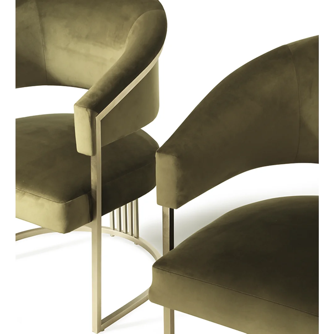 /storage/Luxury brass armchair with elegant harp-shaped design by Castro Interiors.