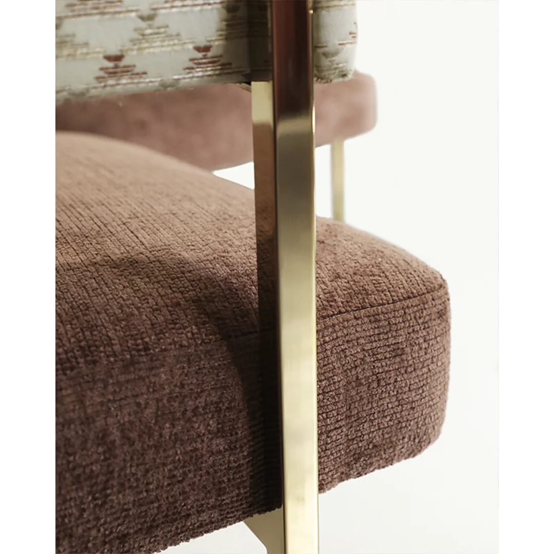 /storage/Luxury brass armchair with elegant harp-shaped design by Castro Interiors.