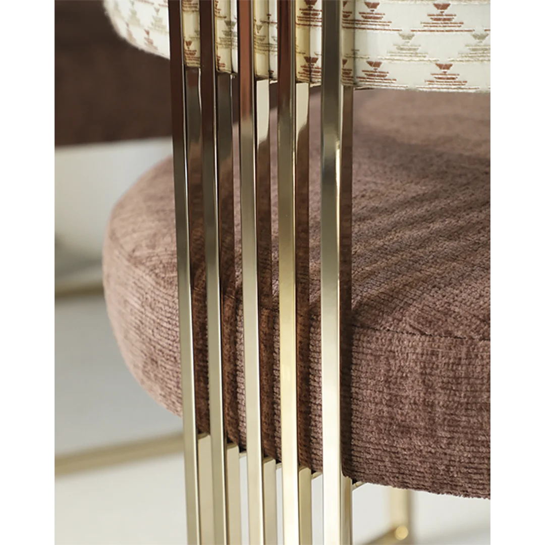 /storage/Luxury brass armchair with elegant harp-shaped design by Castro Interiors.