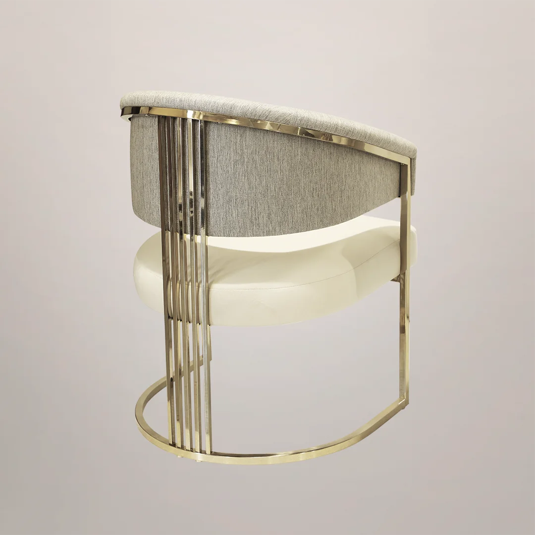 /storage/Luxury brass armchair with elegant harp-shaped design by Castro Interiors.