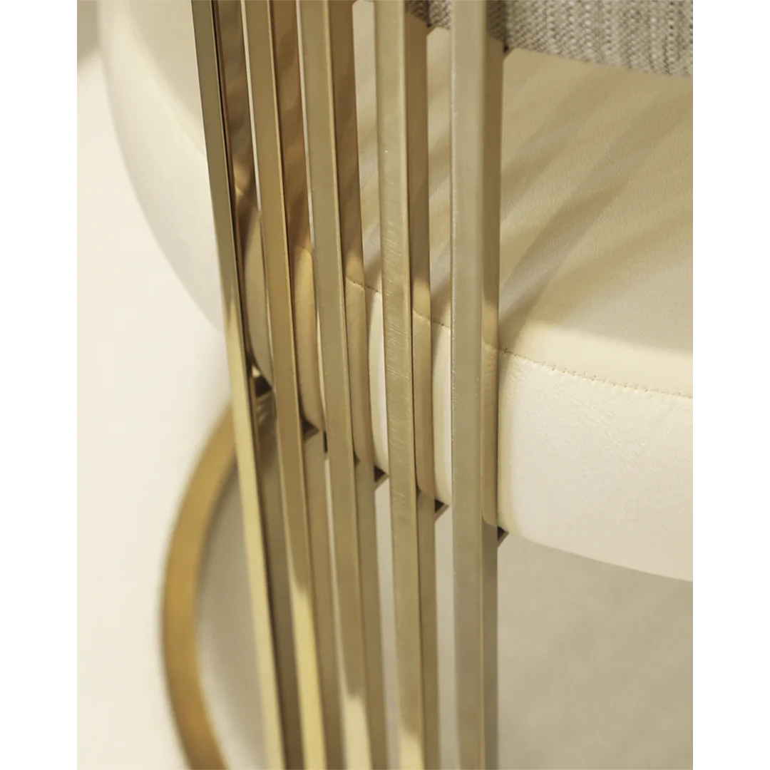 /storage/Luxury brass armchair with elegant harp-shaped design by Castro Interiors.