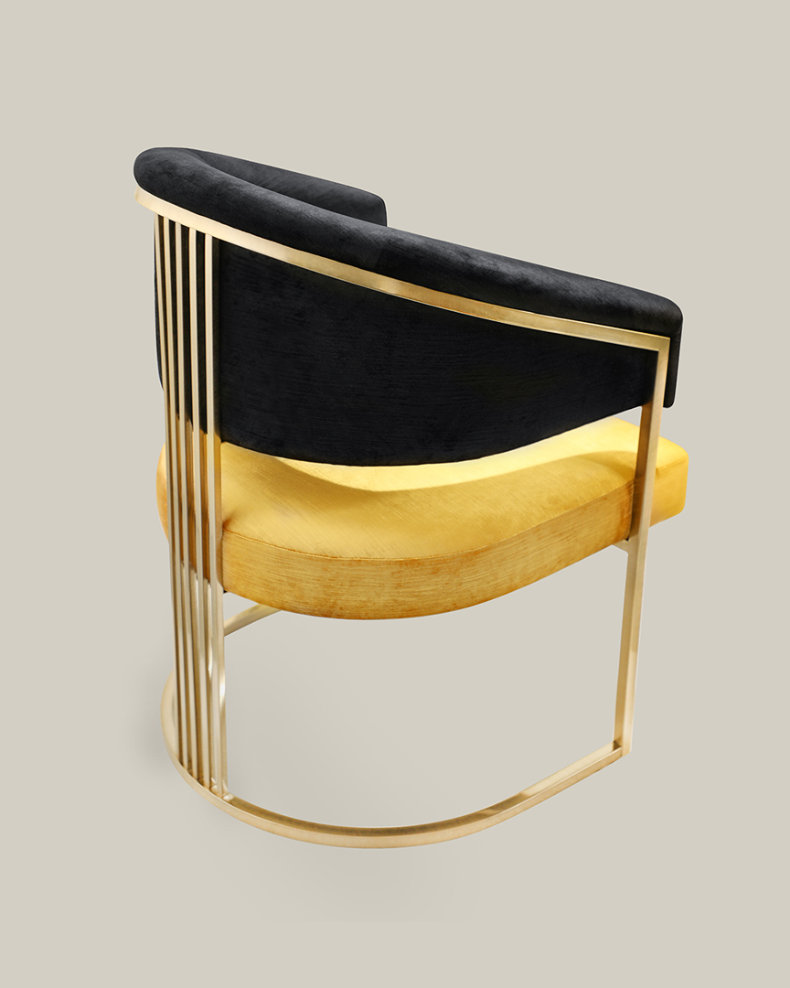 /storage/Luxury brass armchair with elegant harp-shaped design by Castro Interiors.