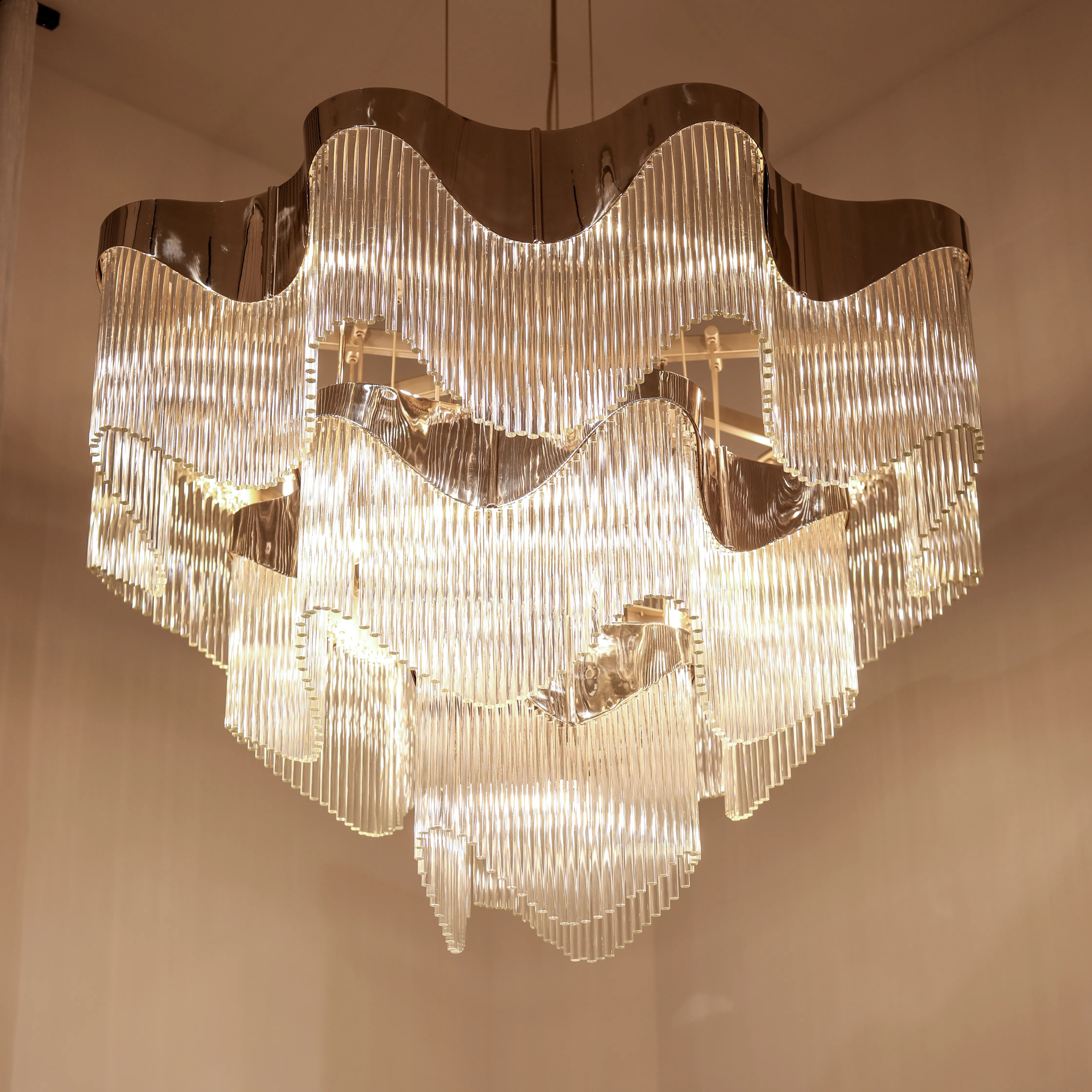 /storage/Luxury brass chandelier with sculptural curves and abstract design by Castro Lighting