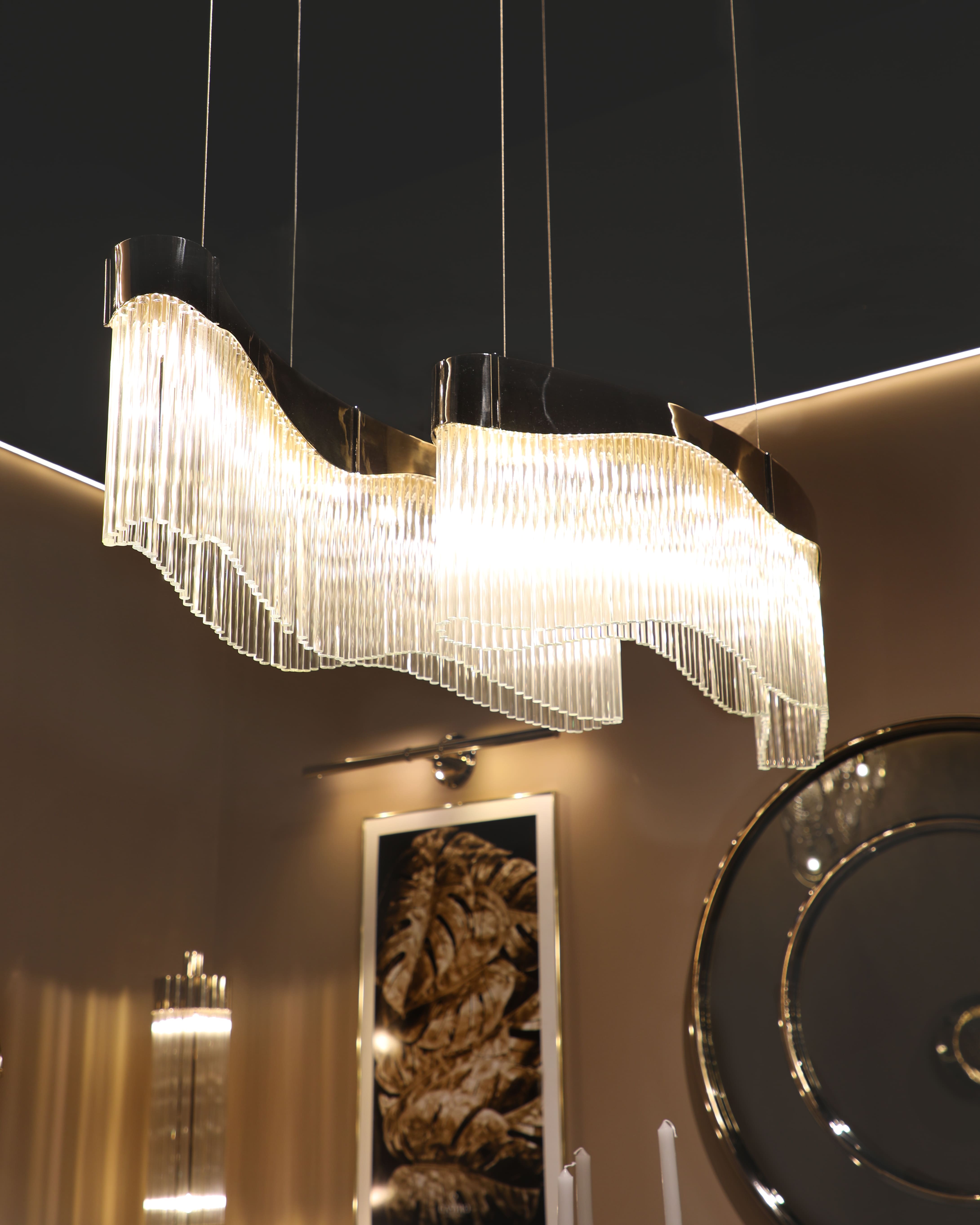 /storage/Luxury brass suspension with fluid curved design and customizable features, offering elegant modern lighting with a sense of movement.
