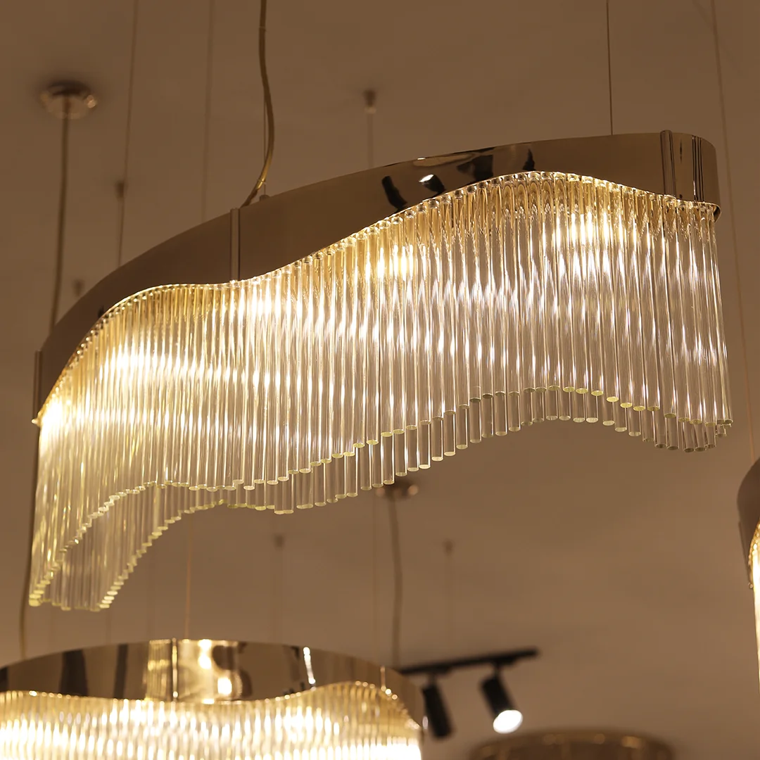 /storage/Luxury brass suspension with fluid curved design and customizable features, offering elegant modern lighting with a sense of movement.