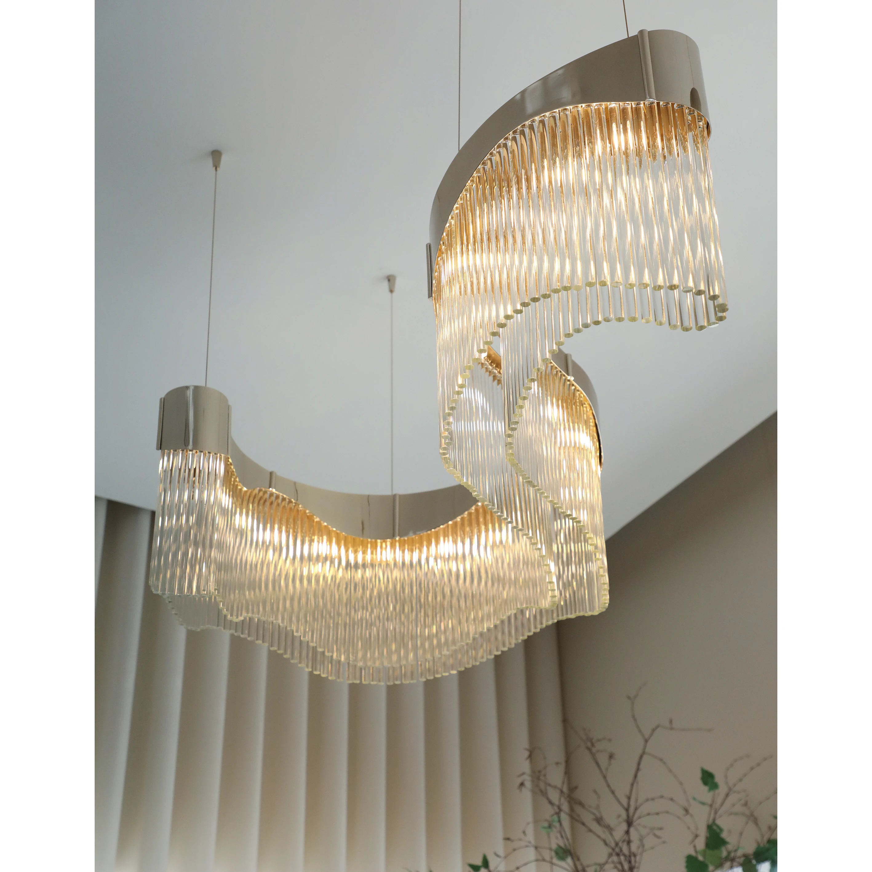 /storage/Luxury brass suspension with sculptural curves and abstract design by Castro Lighting