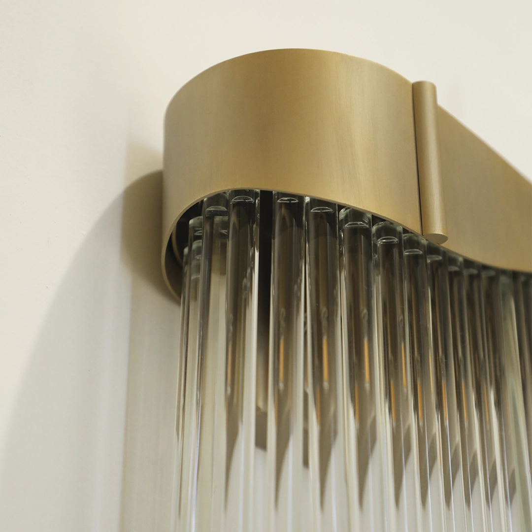 /storage/Luxury brass Flow Wall Light with graceful glass elements, featuring customizable curves and fluid lines for modern interiors.