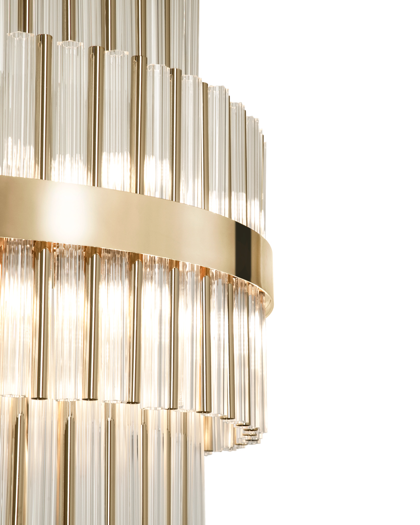 /storage/Luxury brass suspension with clear crystal glass elements, featuring a geometric-inspired design that blends elegance and modern sophistication.