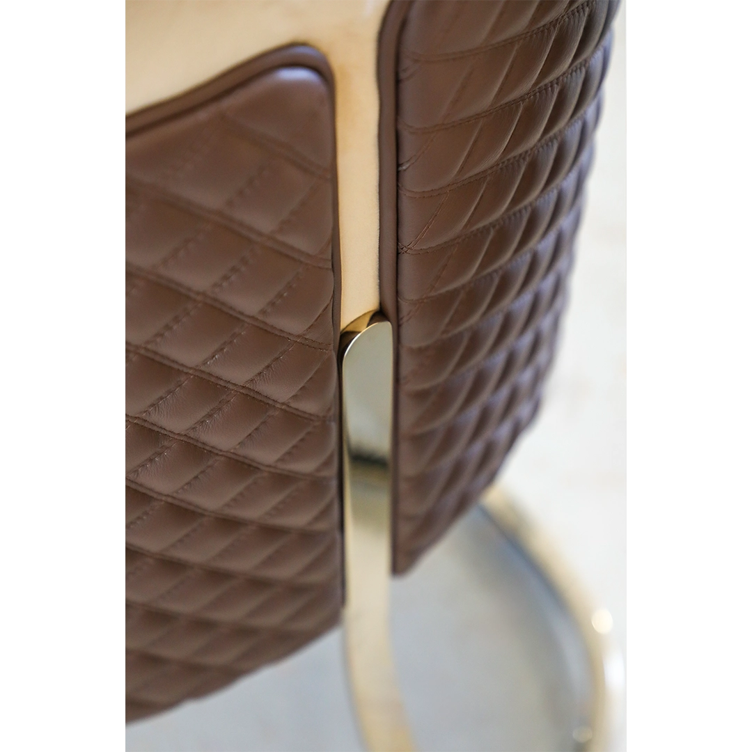 /storage/Luxury brass chair with gold-plated frame and upholstered seat, inspired by Greek elegance
