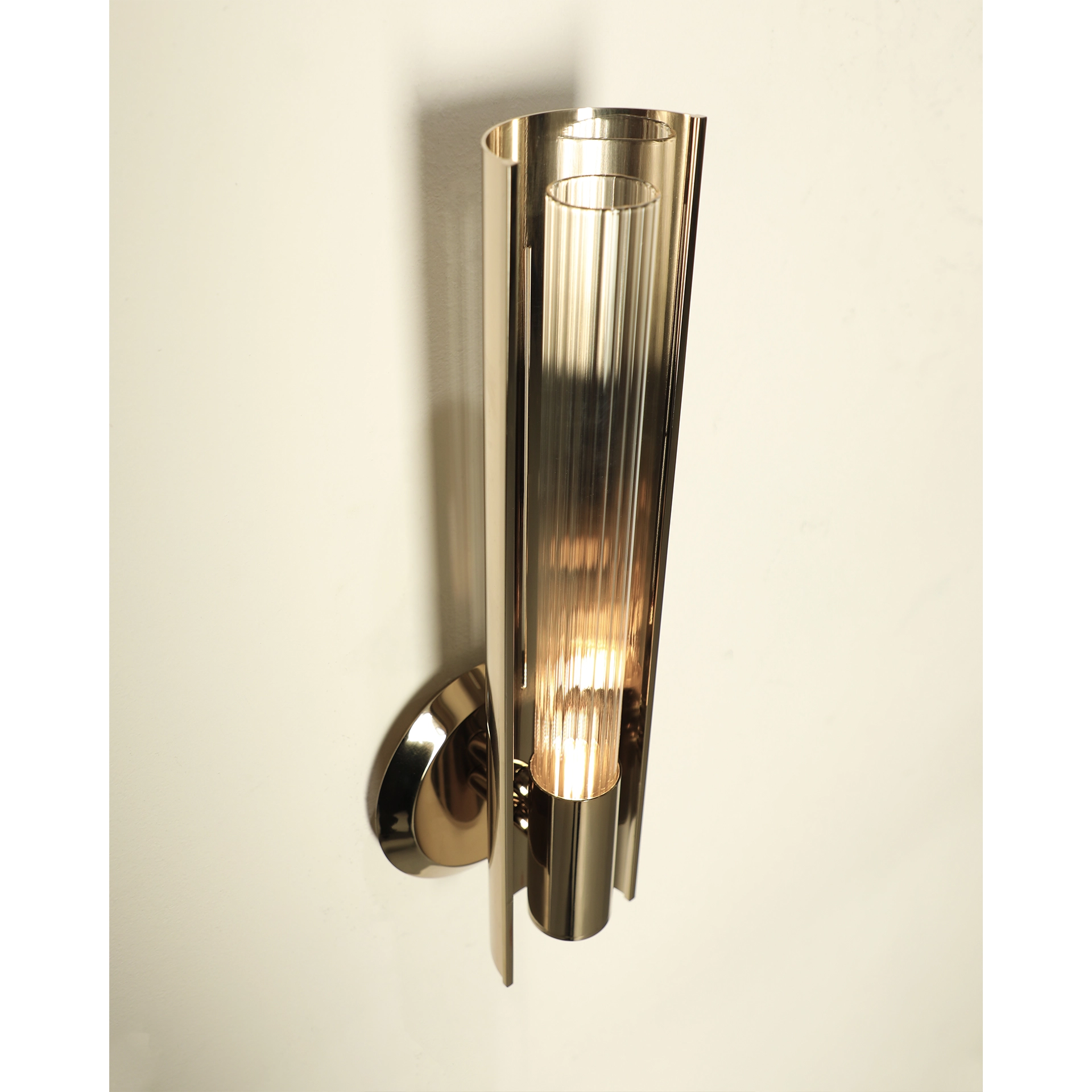 /storage/Luxury brass Baccara Wall Light with corrugated glass and refined futuristic design.