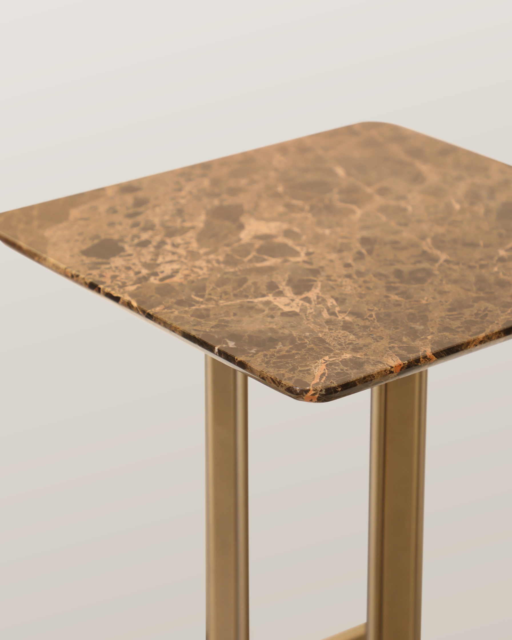 /storage/Luxury brass Columns Center Table with marble top, a modern geometric design exuding elegance and sophistication.