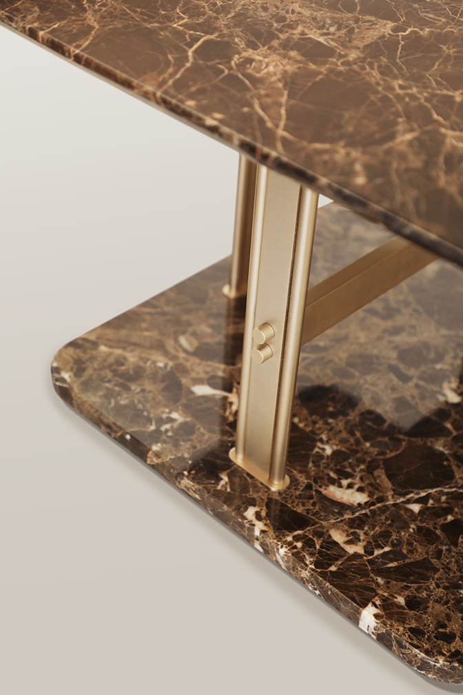 /storage/Luxury brass and marble center table with geometric columns, blending modern elegance and bold design for a refined, opulent living space.