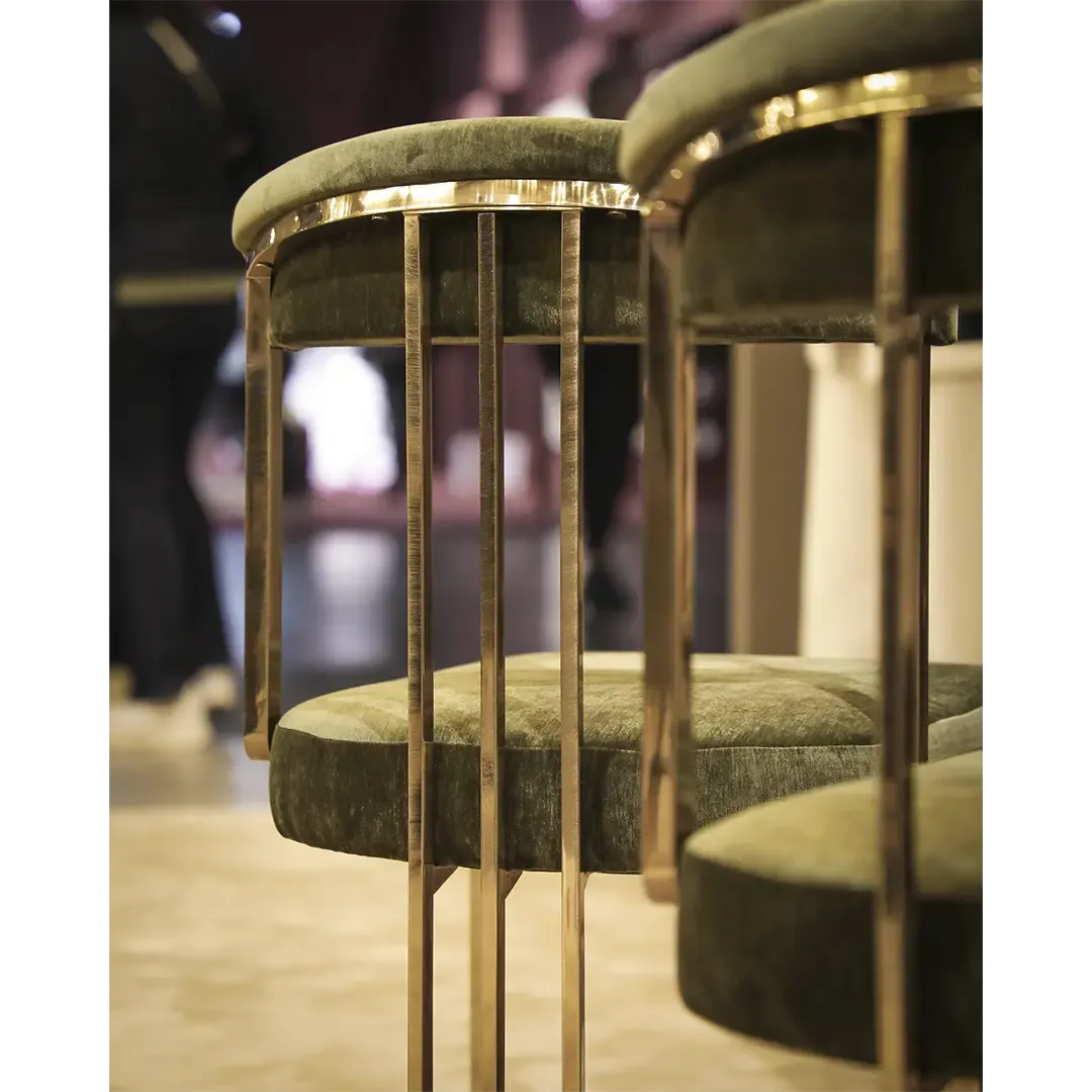 /storage/Luxury brass chair with elegant harp-shaped design by Castro Interiors.