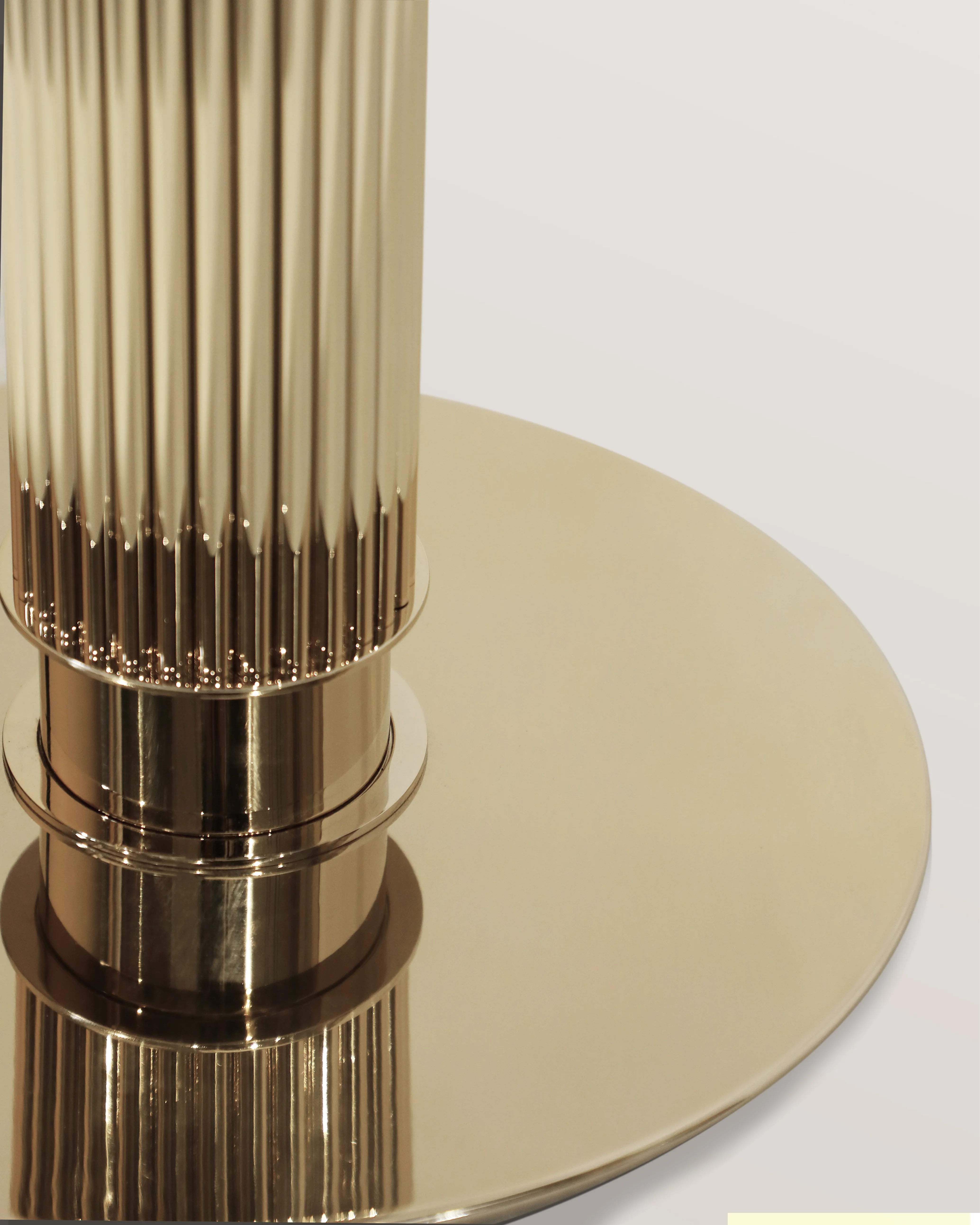 /storage/Luxury brass Eléa Bar Table with Corinthian column-inspired gold-plated brass base and Emperador marble top, blending classical Greek elegance with modern sophistication for refined dining and bar interiors.