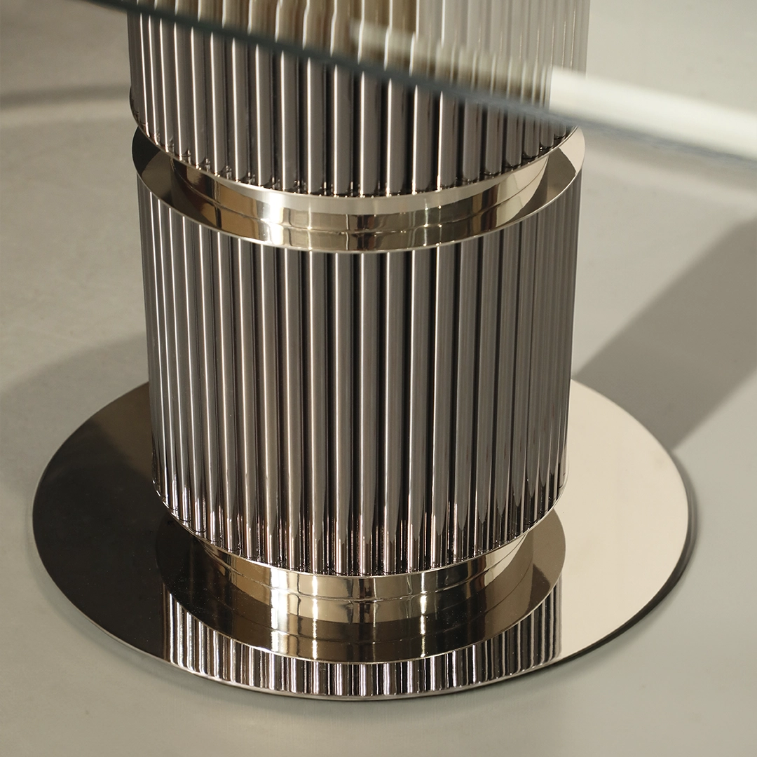 /storage/Luxury brass Eléa Dining Table with glass top and eucalyptus frisé wood, inspired by Ancient Greece elegance.