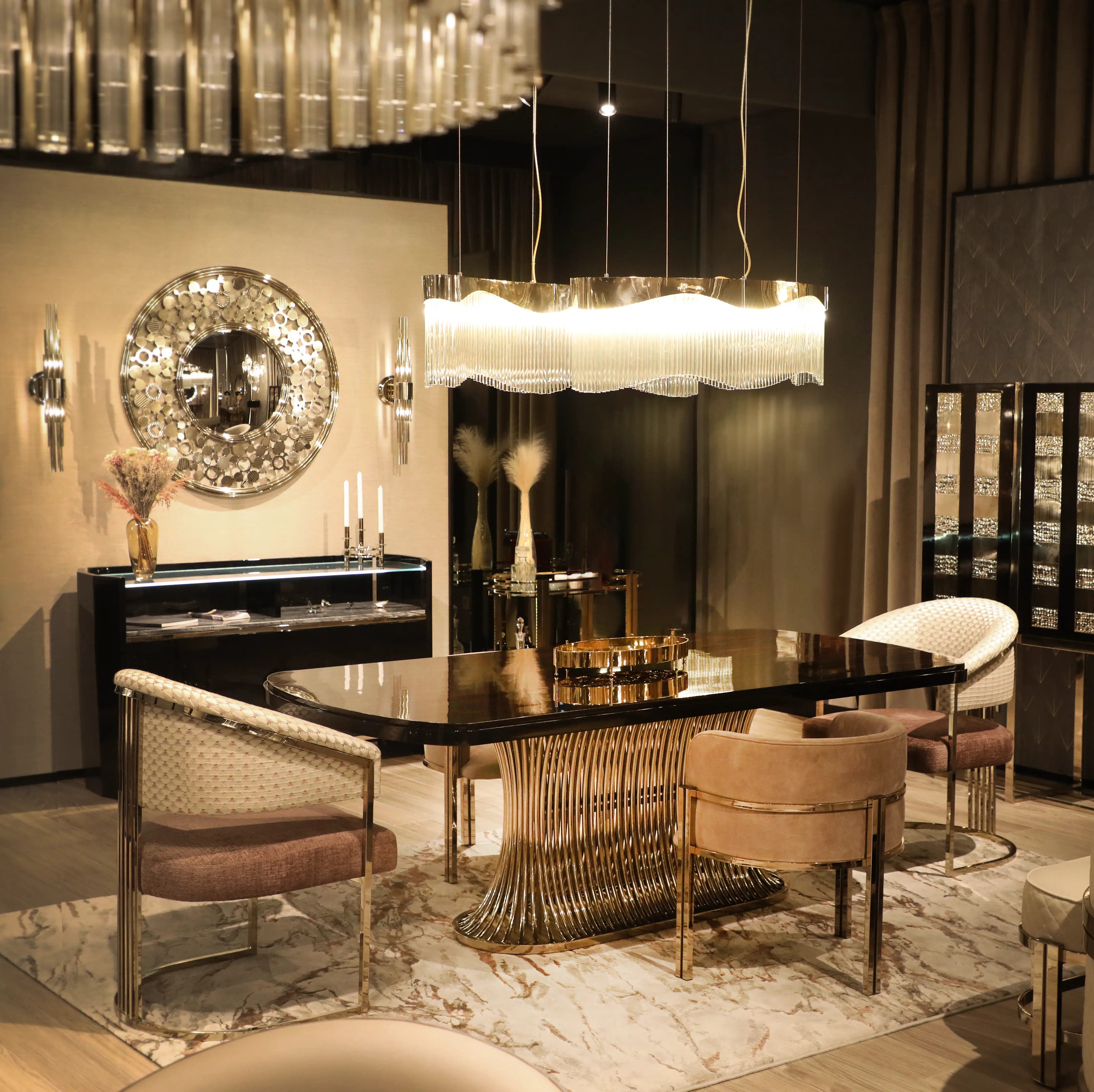 /storage/Luxury brass and Emperador marble dining table with flowing curved tube base, a sculptural modern design for elegant interiors.
