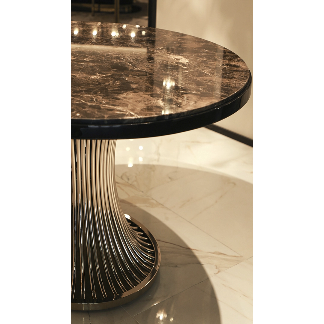 /storage/Luxury brass dining table with flowing sculptural base and round Emperador marble top, inspired by the elegant movement of dancers and crafted for sophisticated interiors.
