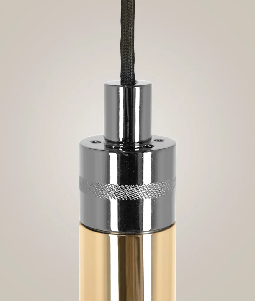 /storage/Luxury brass Gio pendant with geometric gold and nickel structure inspired by Italian modernist design.