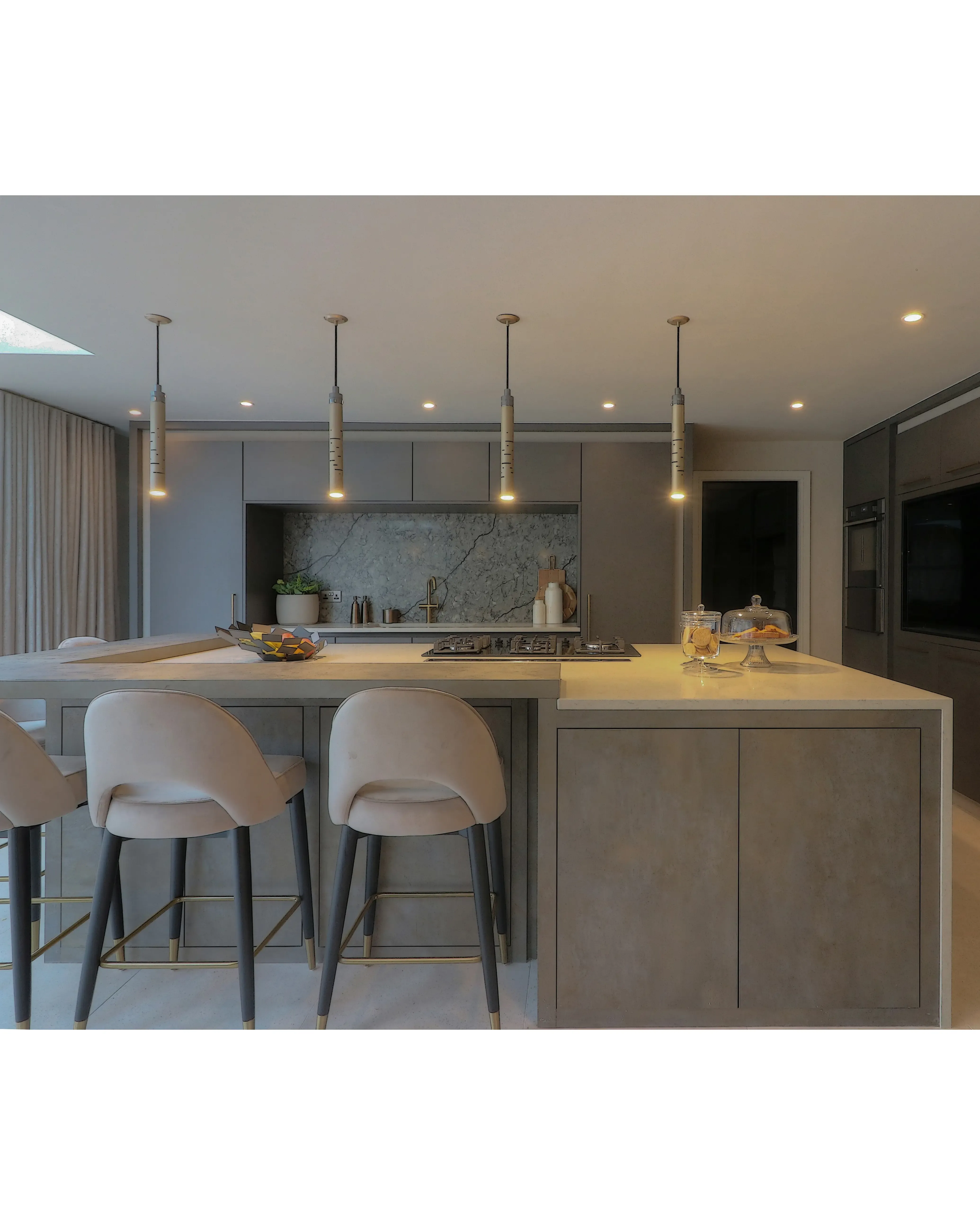 /storage/Luxury brass Gio pendant with geometric gold and nickel structure inspired by Italian modernist design.