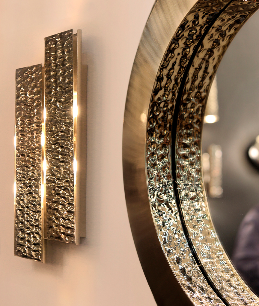 /storage/Luxury brass Golden Eye mirror, crafted in polished and hammered brass with a radiant 24k gold finish, inspired by James Bond’s cinematic elegance.